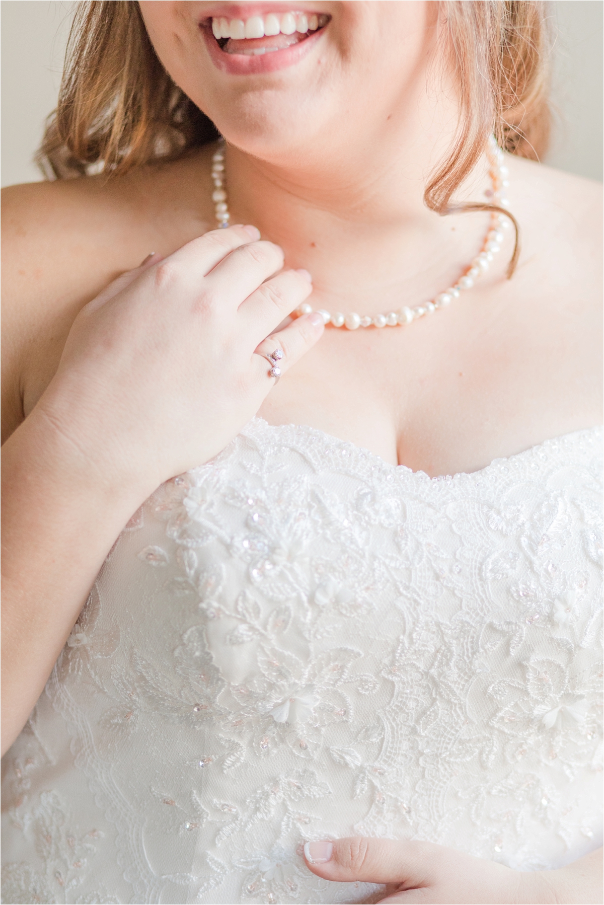 bridal-portraits-photos-bride-alabama-wedding-photographer-putting-jewelry