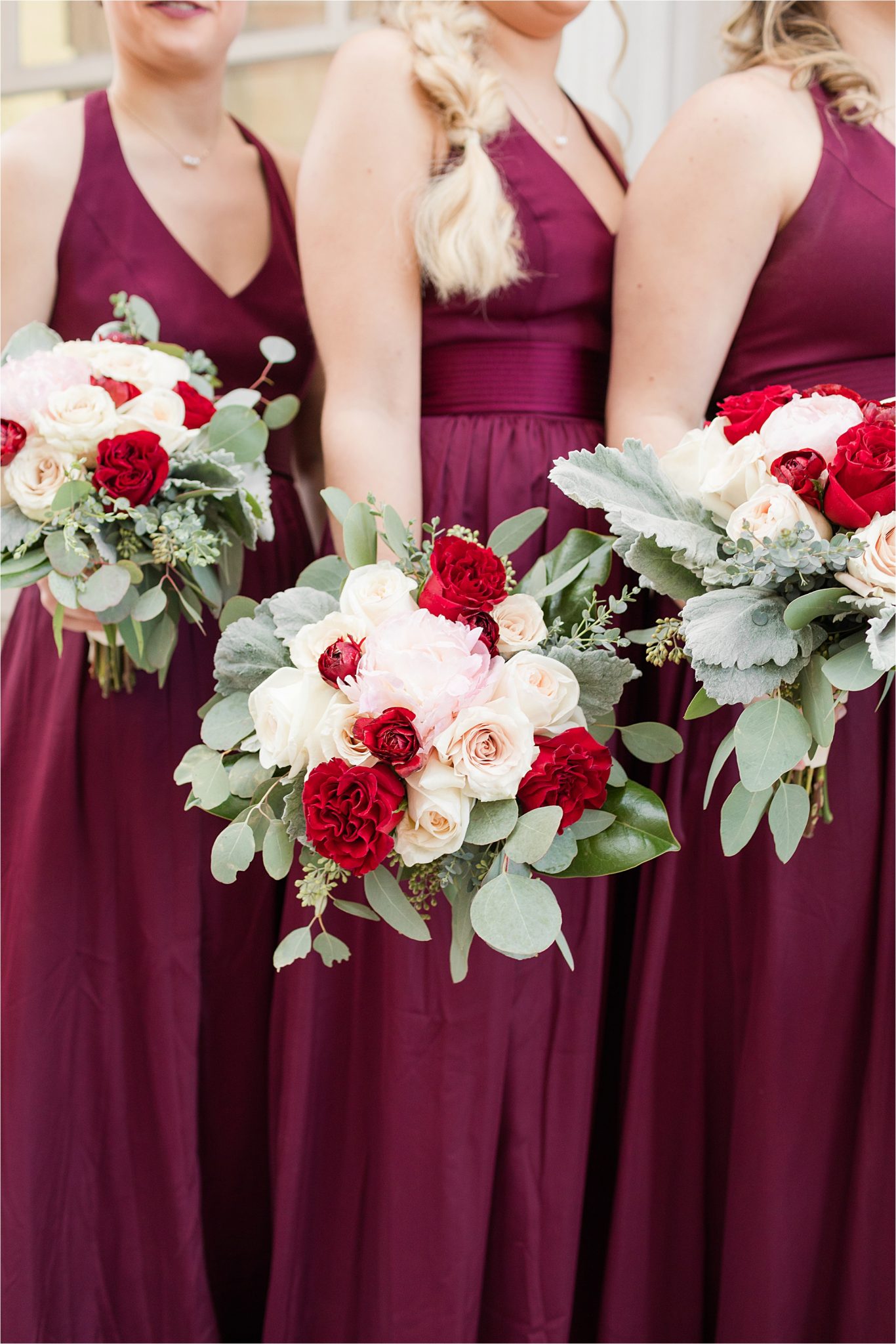 bridesmaids-deep-magenta-plum-dresses-red-white-roses-christmas-wedding-alabama