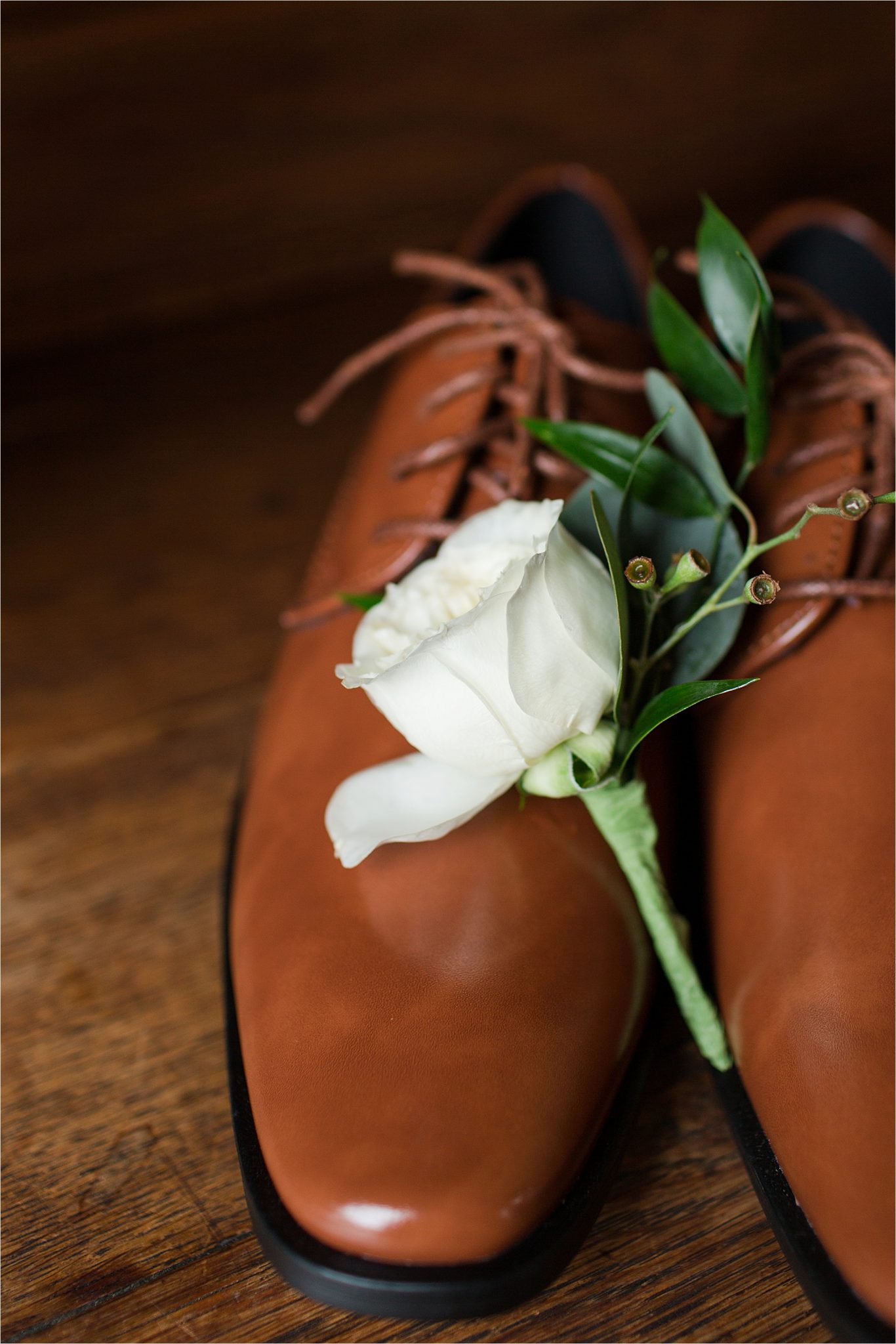 white rose corsage-light brown dress shoes-shiny