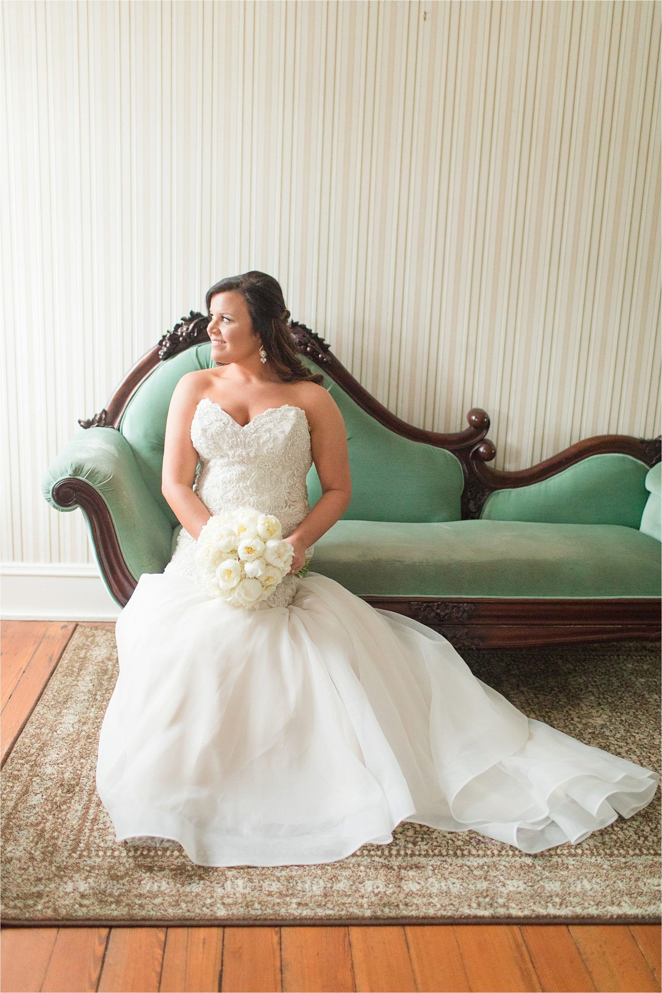 bride on antique couch-antique teal couch-mermaid style wedding dress-strapless