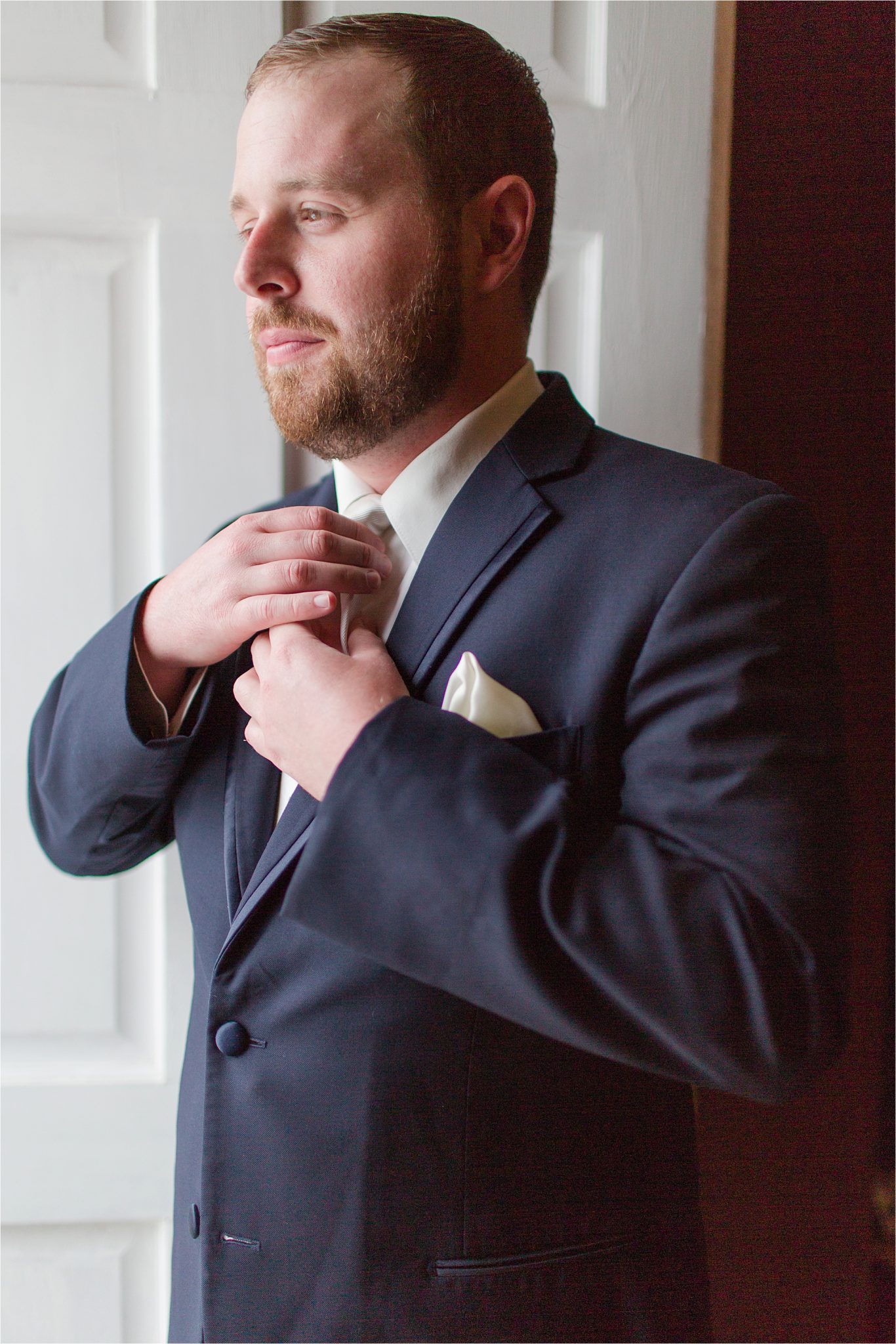 Groom-beard-navy suit-redhead-ivory handkerchief 