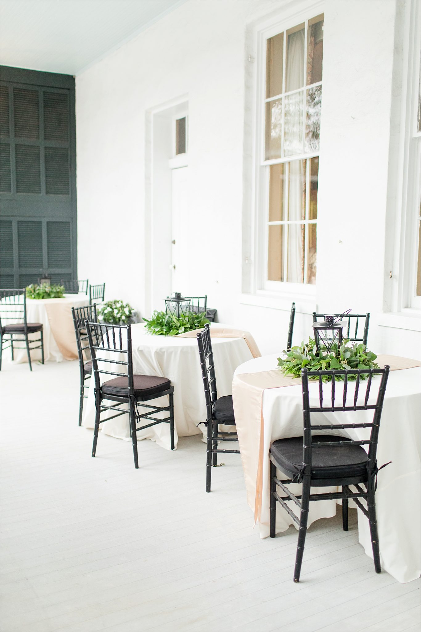 black wooden chairs-reception-lantern center pieces- neutrals-black tie event-round tables-neutral runner-wedding day-alabama wedding photographer