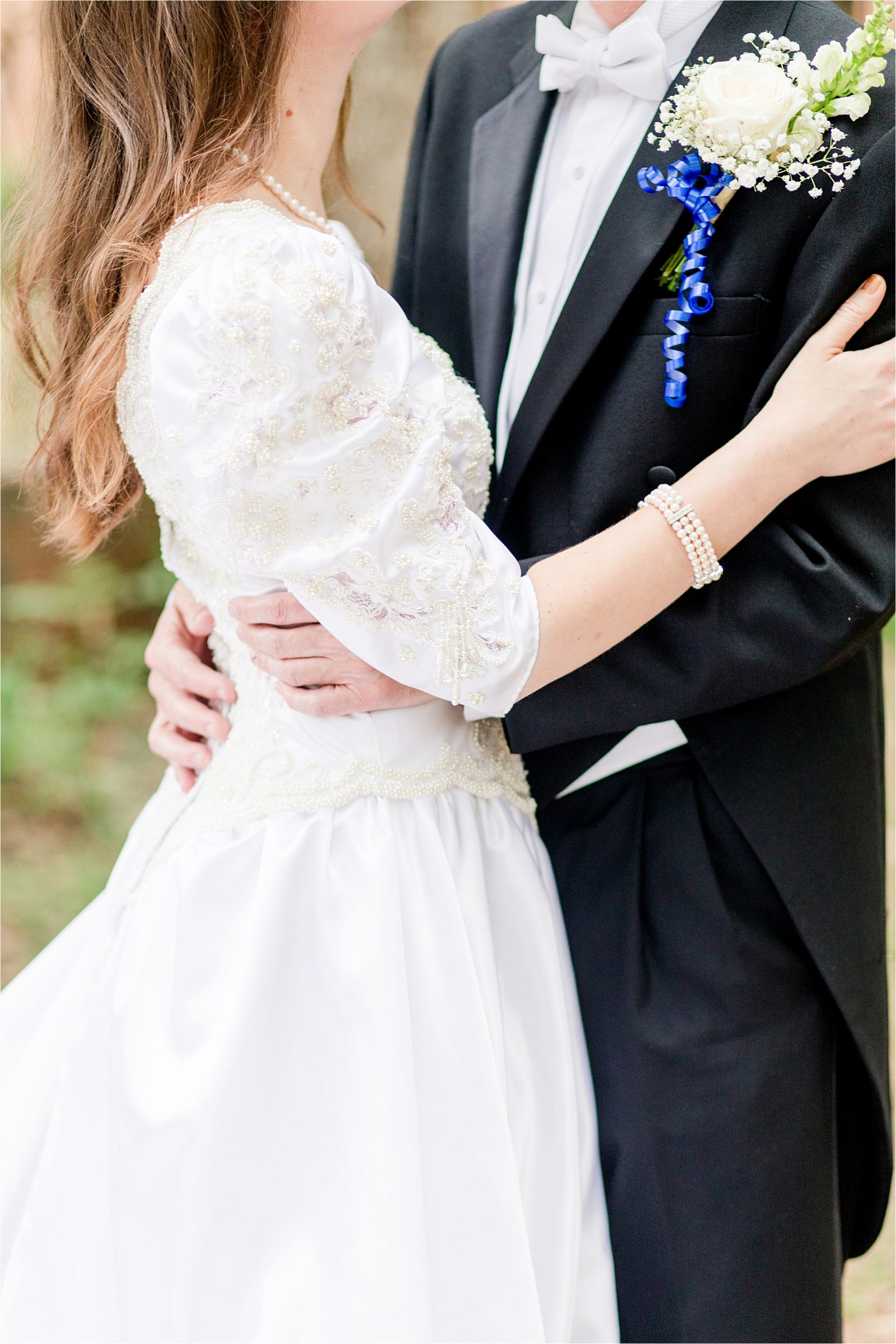 wedding dress with puffy sleeves-pearl beading-rose corsage-bride and groom