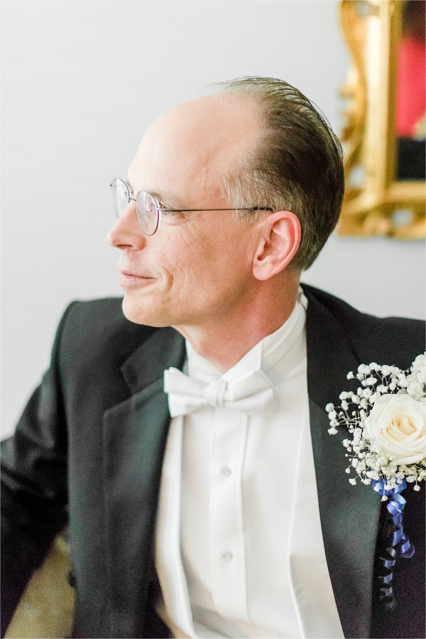 mature groom-groom with white bowtie- white rose corsage-groom corsage