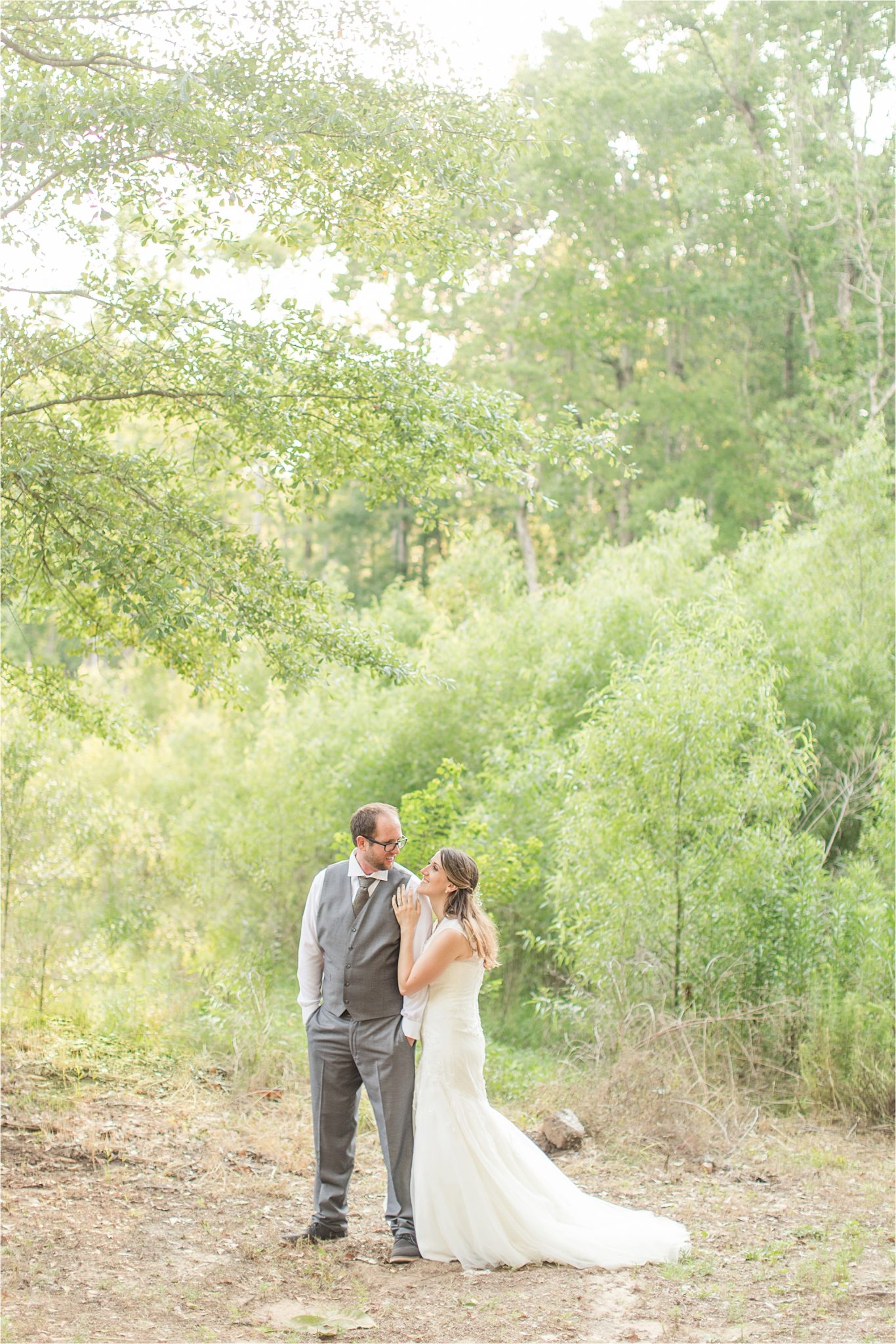 photos of the bride and groom-grey suit-groom in vest-backyard country wedding