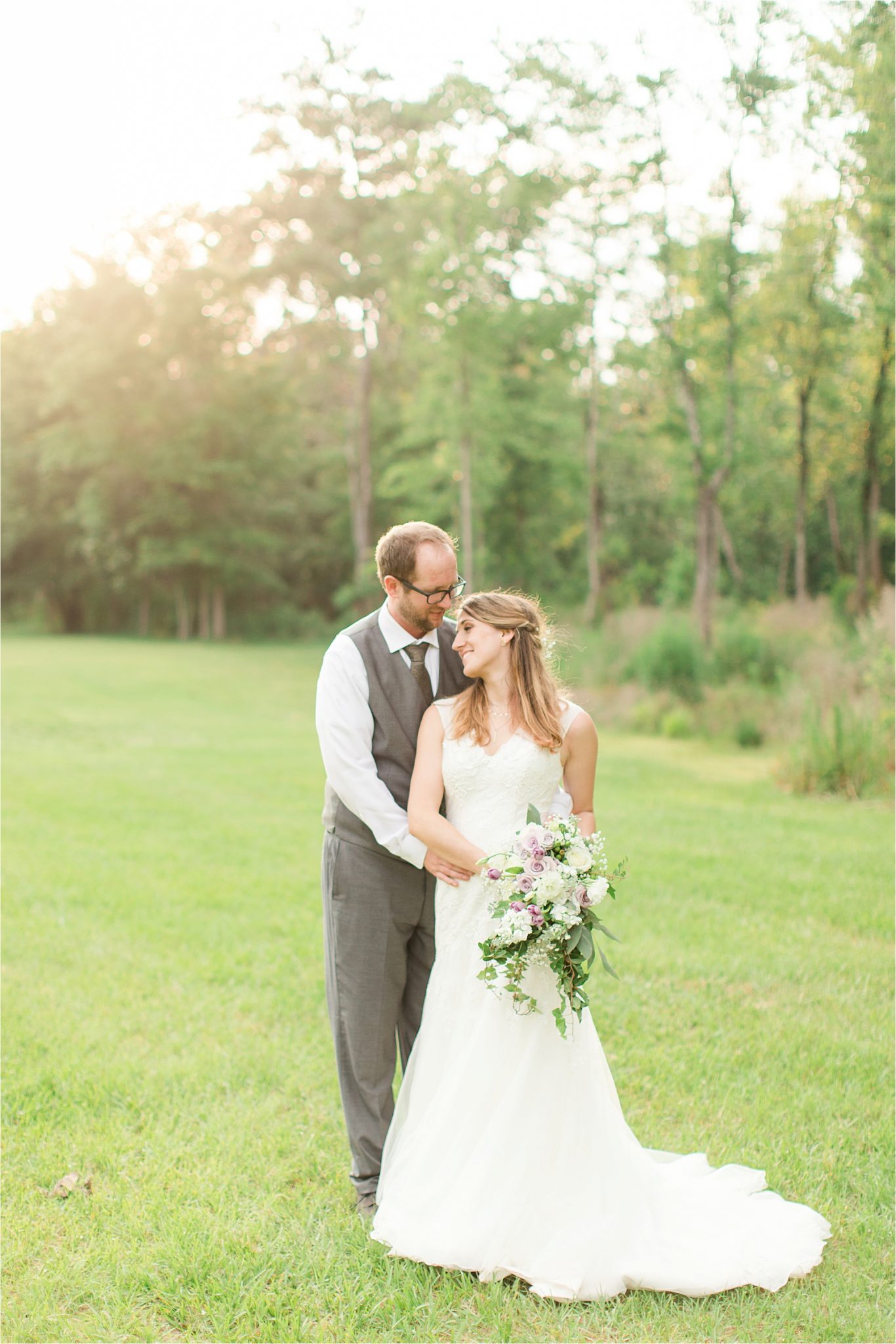 photos of the bride and groom-grey suit-groom in vest-lavender bouquet-backyard country wedding