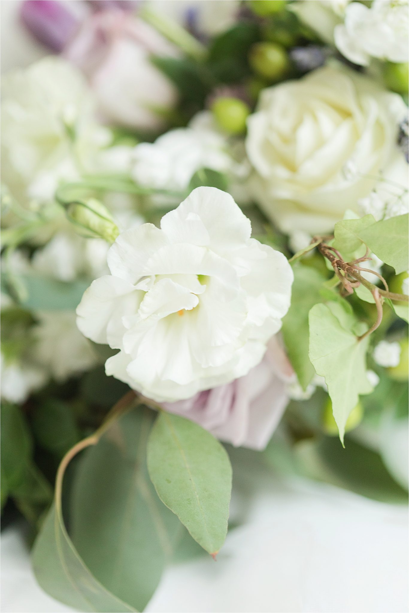 lavender-white roses-flowers-greenery-white wedding bouquet
