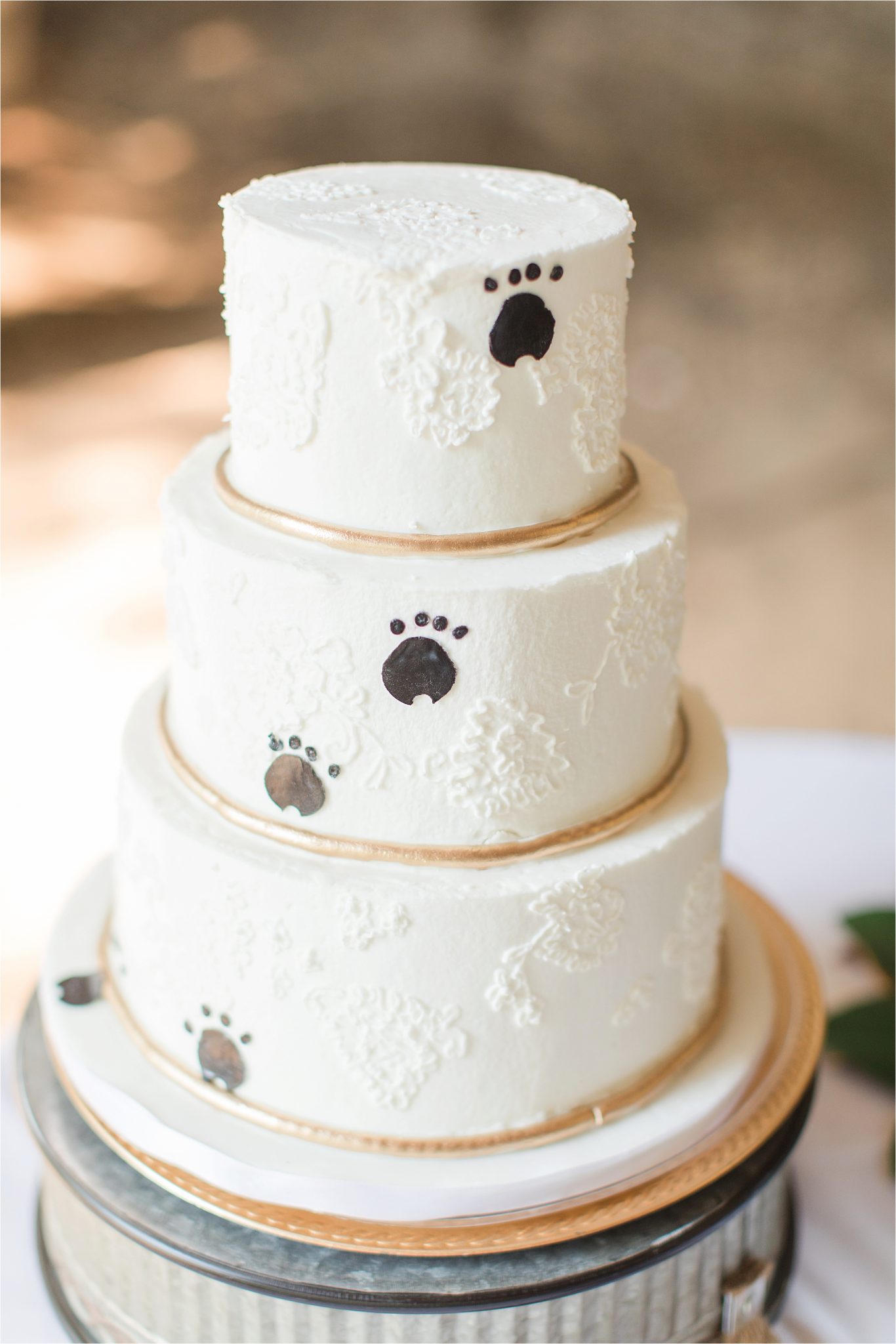wedding cake-paw prints-dog cake-three tier wedding cake-gold accents