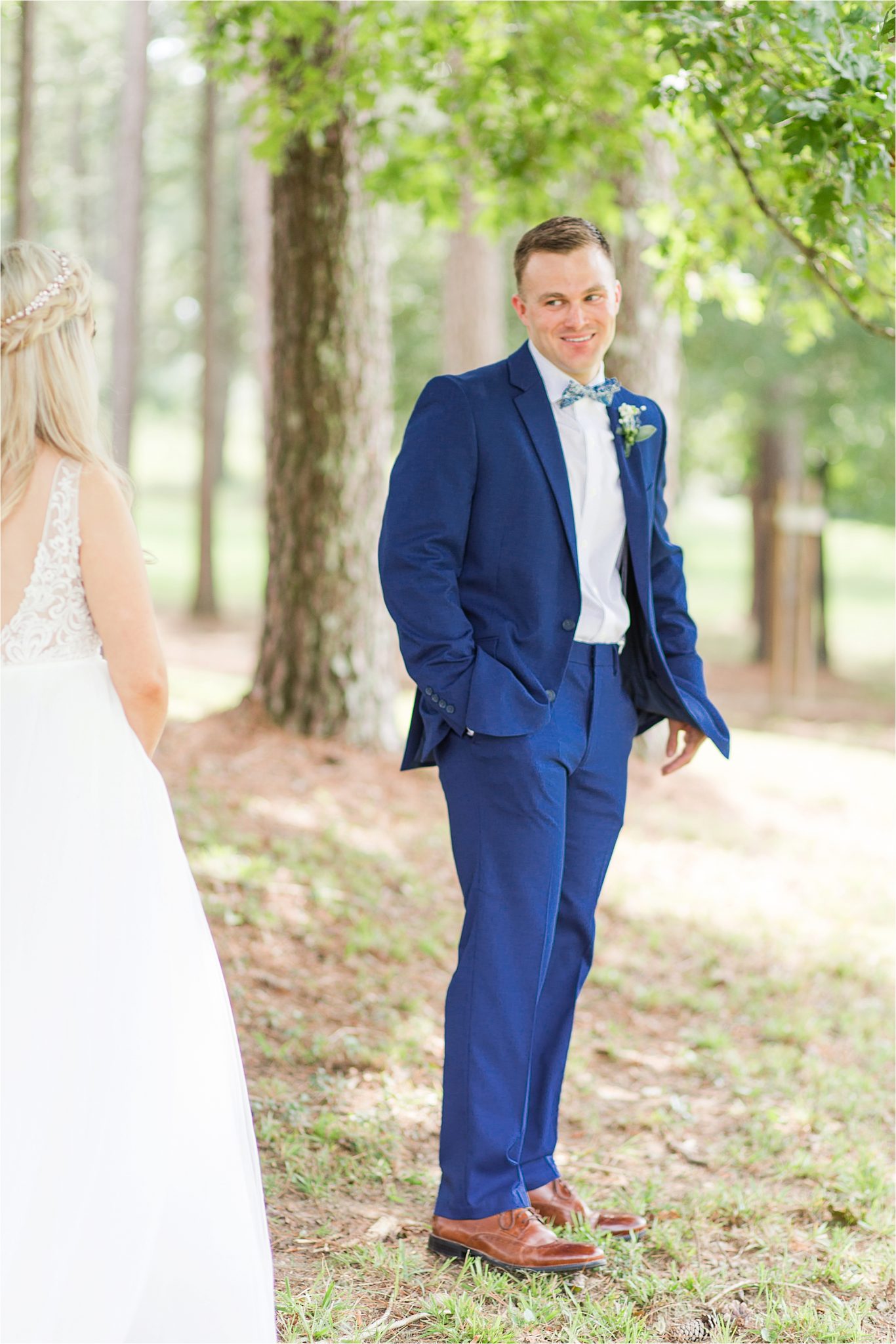 blue-suit-groom-bride-bow-tie-first-look