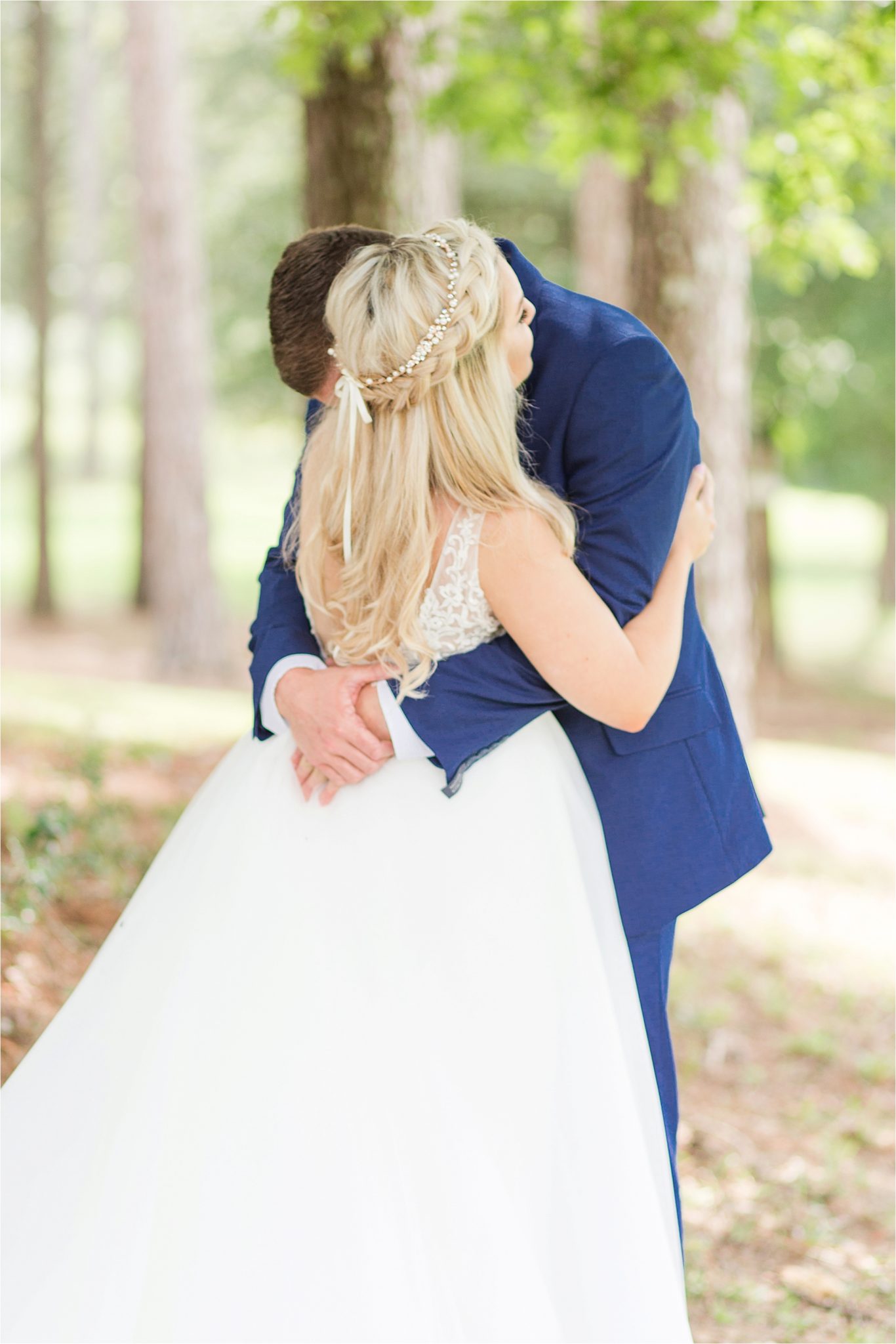 blue-suit-groom-bride-bow-tie-first-look