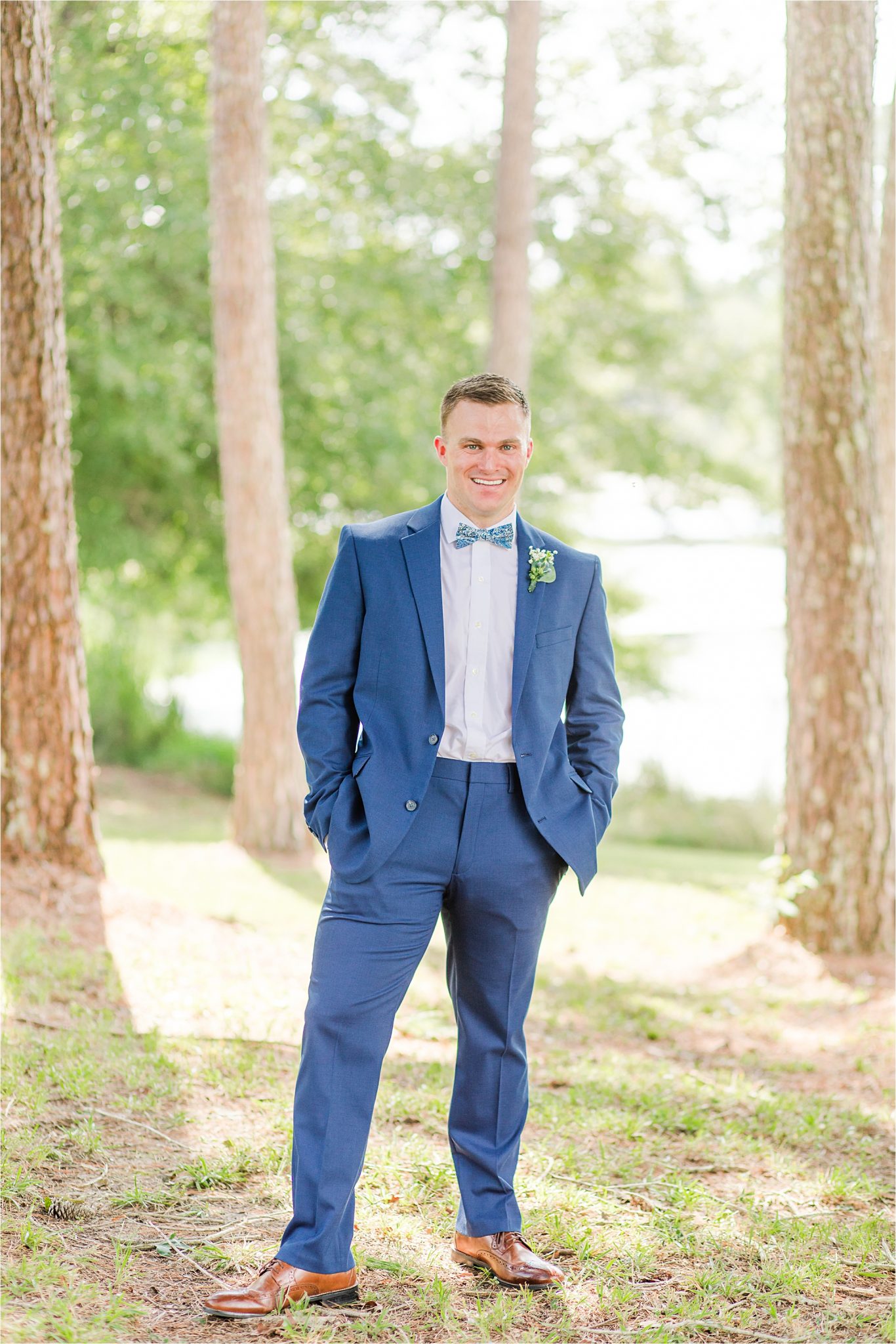 blue-grooms-suit-bow-tie-clean-cut-fitted-white-dress-shirt-portrait