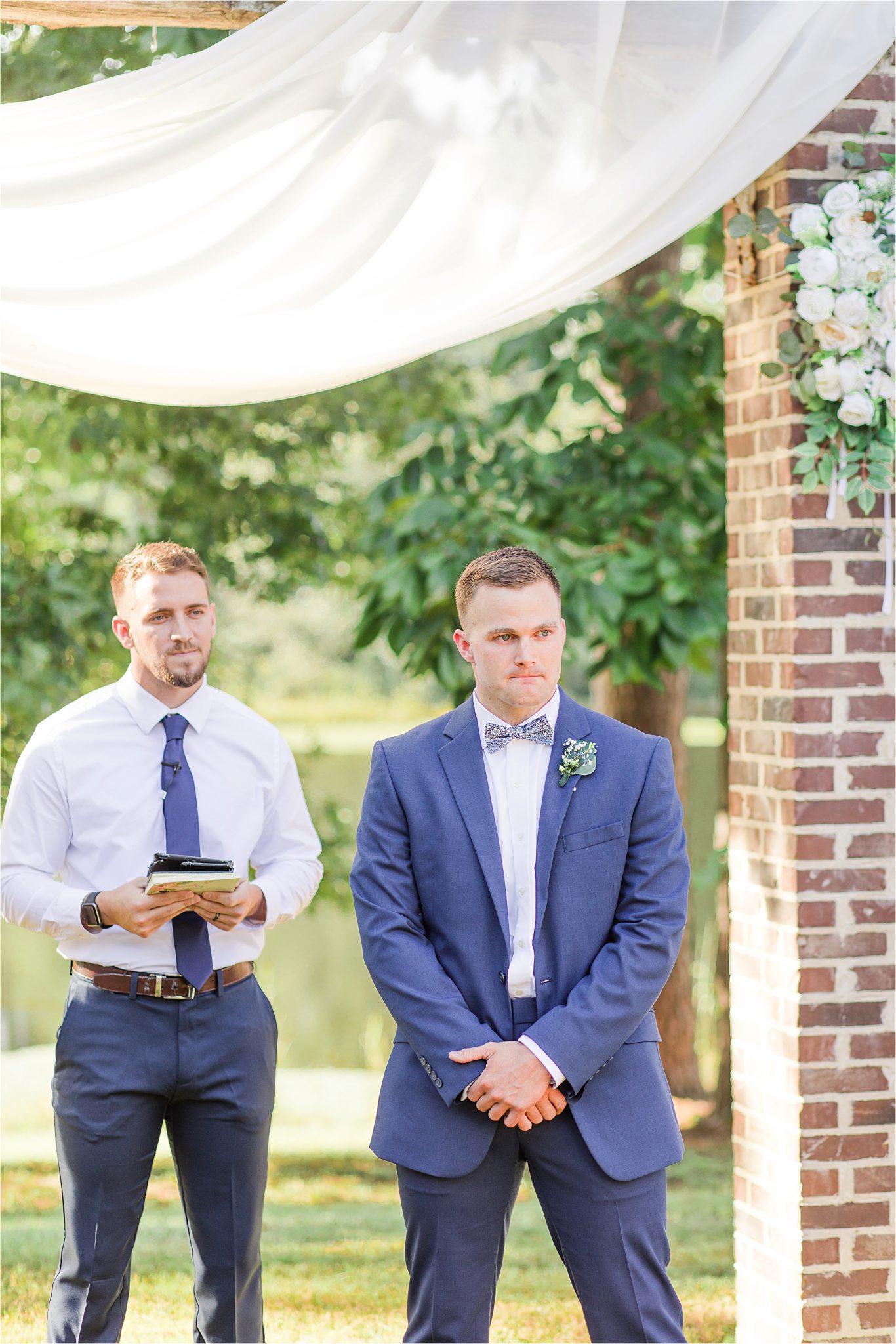 groom at the end of the aisle-blue-steel-wedding-color