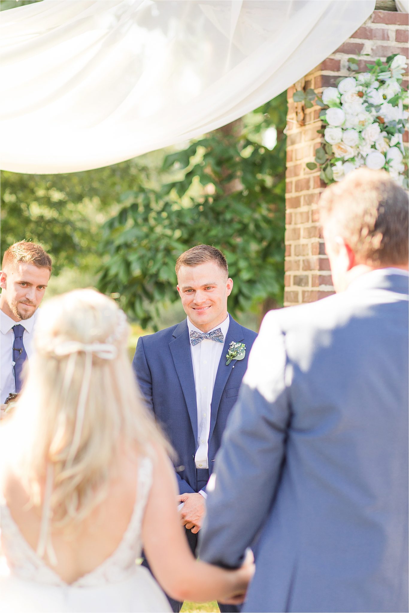 groom at the end of the aisle-blue-steel-wedding-color-first-look