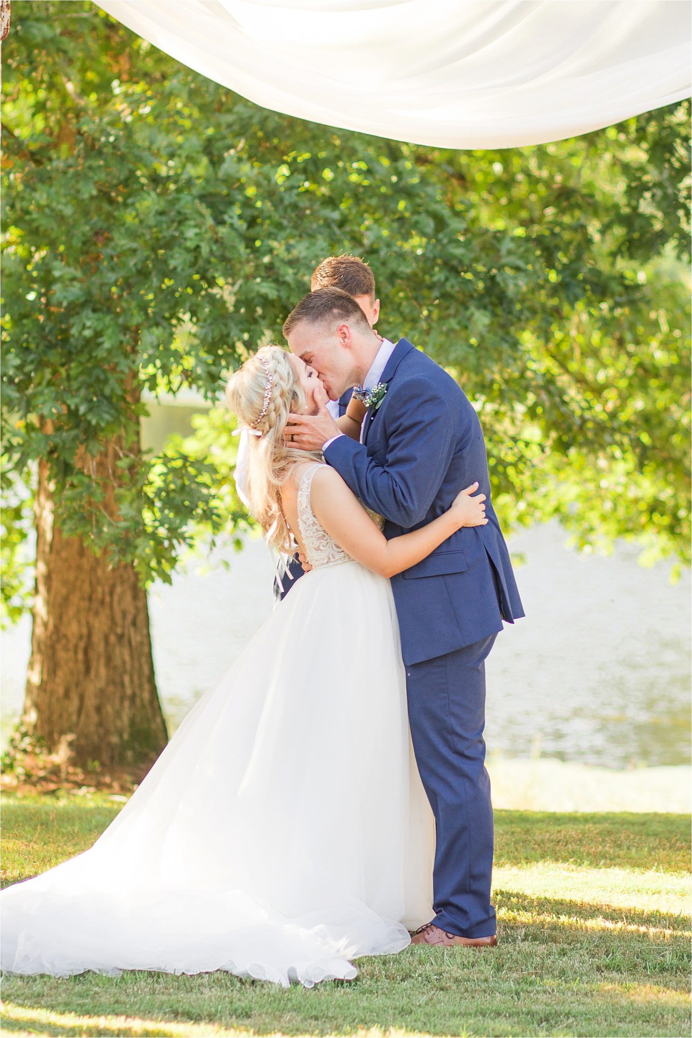 wedding-ceremony-alabama-wedding-photographer-blue-navy-first-kiss