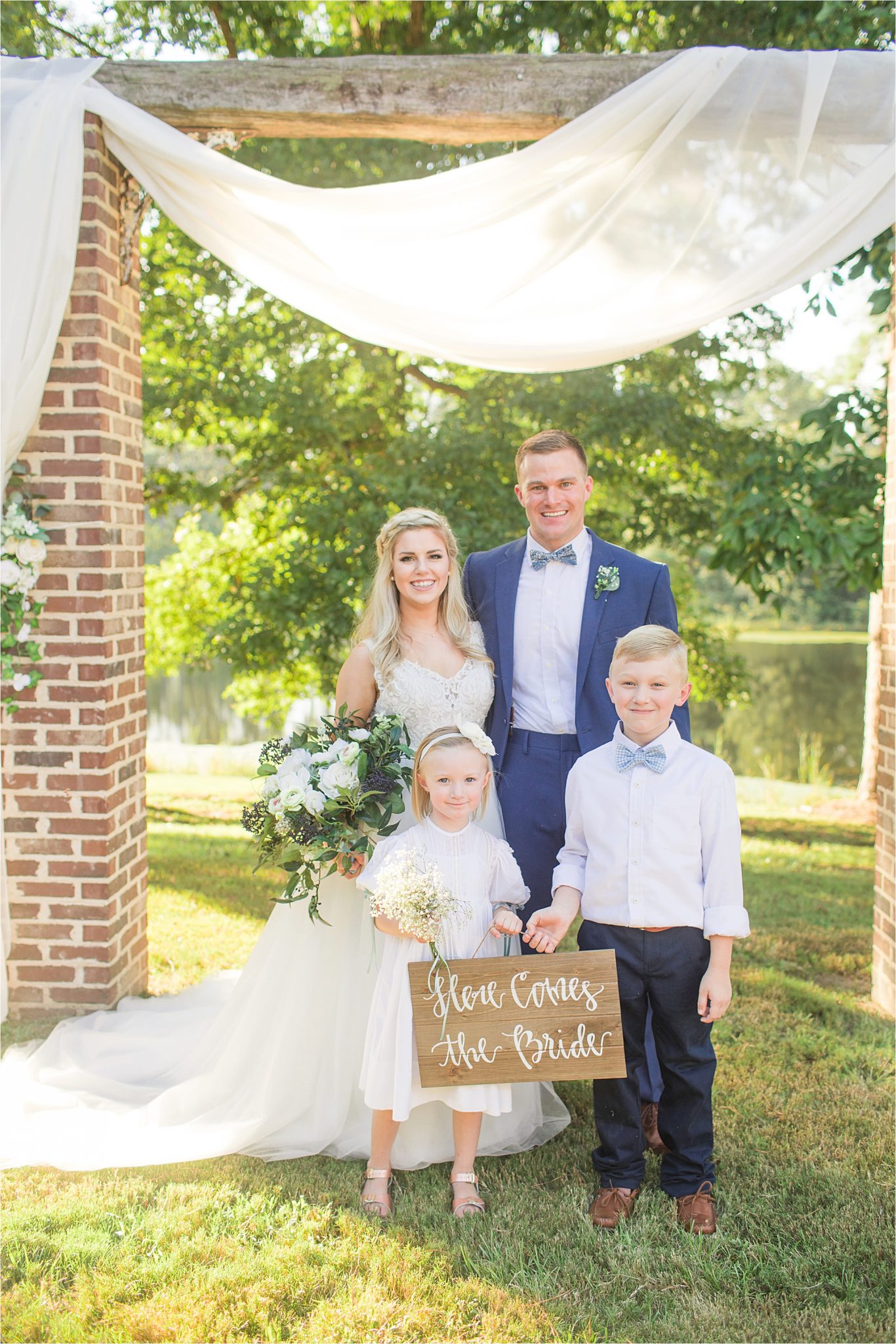 wedding-sign-here comes the bride-flower-girl-ring-bearer-bride-groom