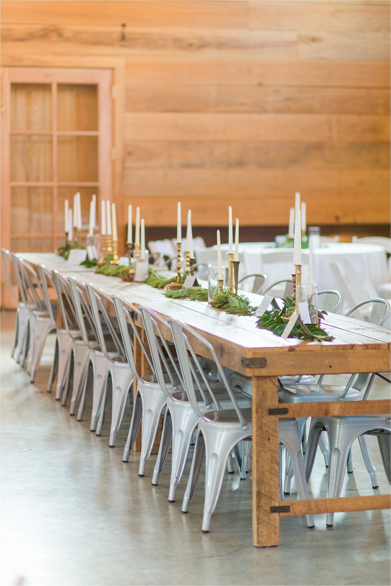 wedding-reception-alabama-venue-barn-farm-tables-metal-chairs-candle-centerpieces