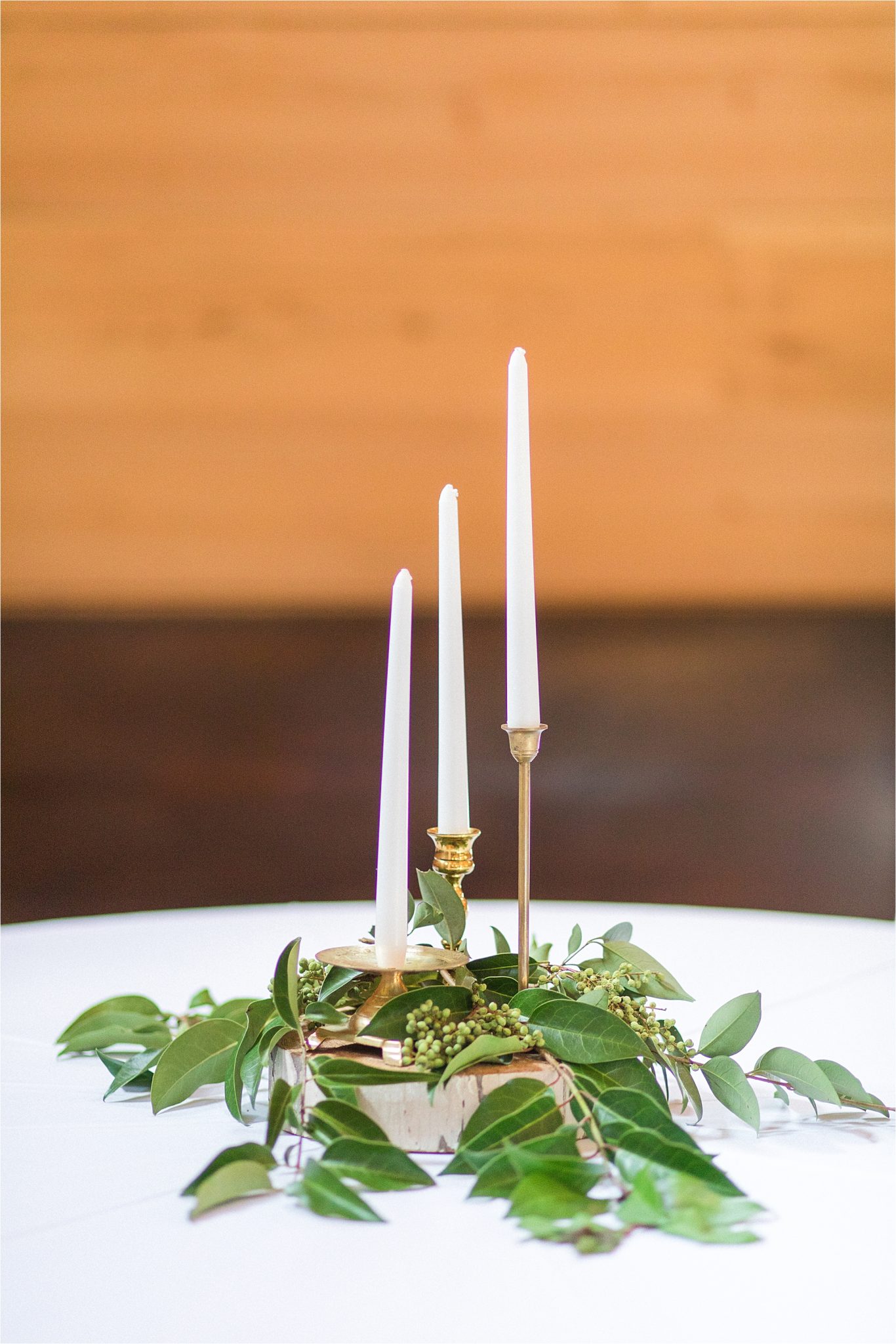 gold-candlestick-centerpieces-vines-white-ivory-greenery