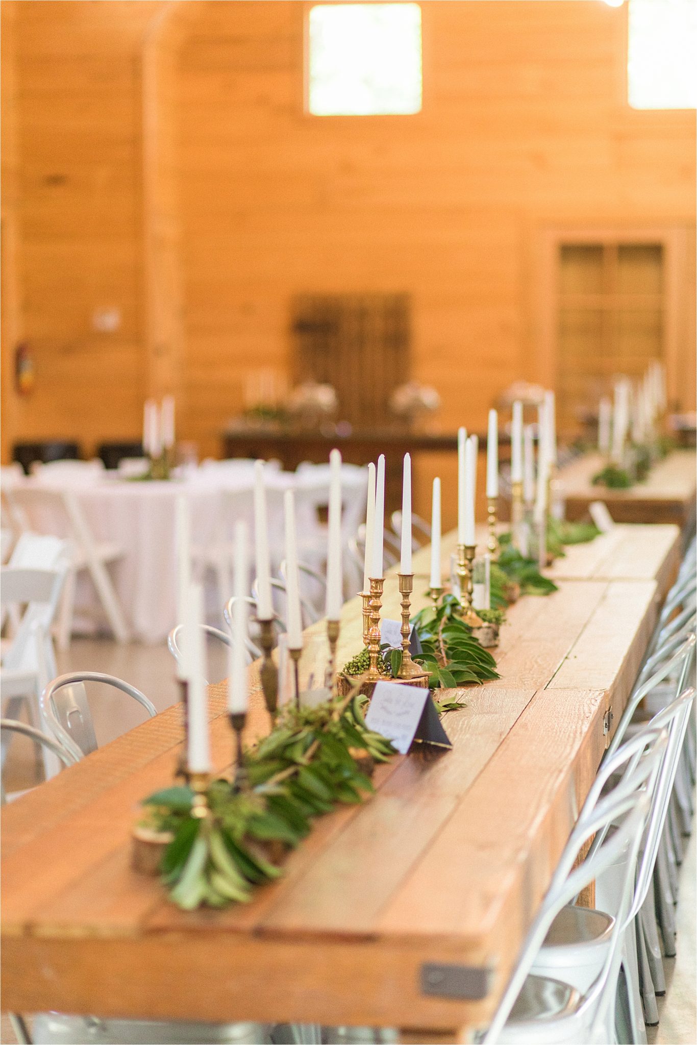 wedding-reception-alabama-venue-barn-farm-tables-metal-chairs-candle-centerpieces-gold-candlesticks