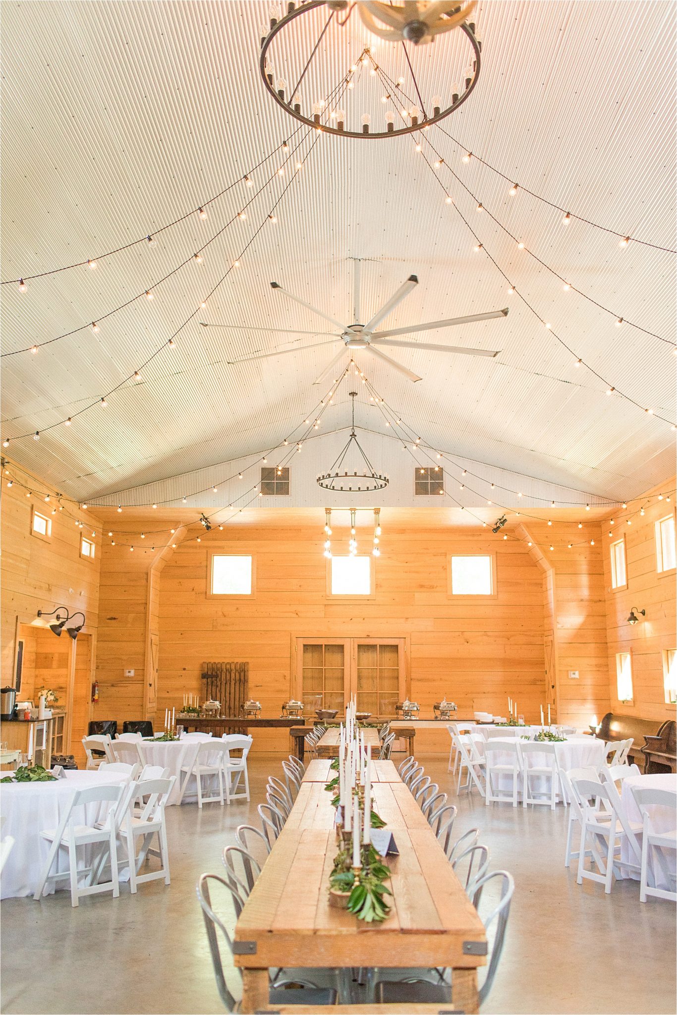 wedding-reception-alabama-venue-barn-farm-tables-metal-chairs-candle-centerpieces-shiplap