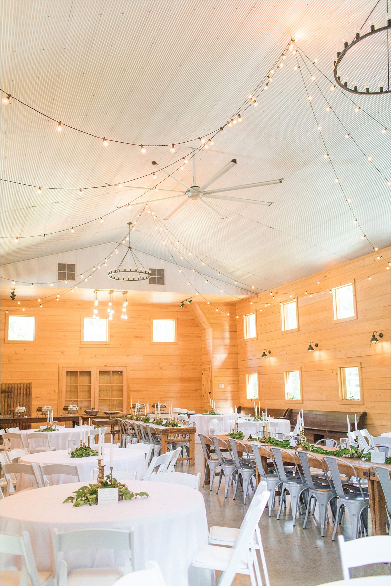 wedding-reception-alabama-venue-barn-farm-tables-metal-chairs-candle-centerpieces