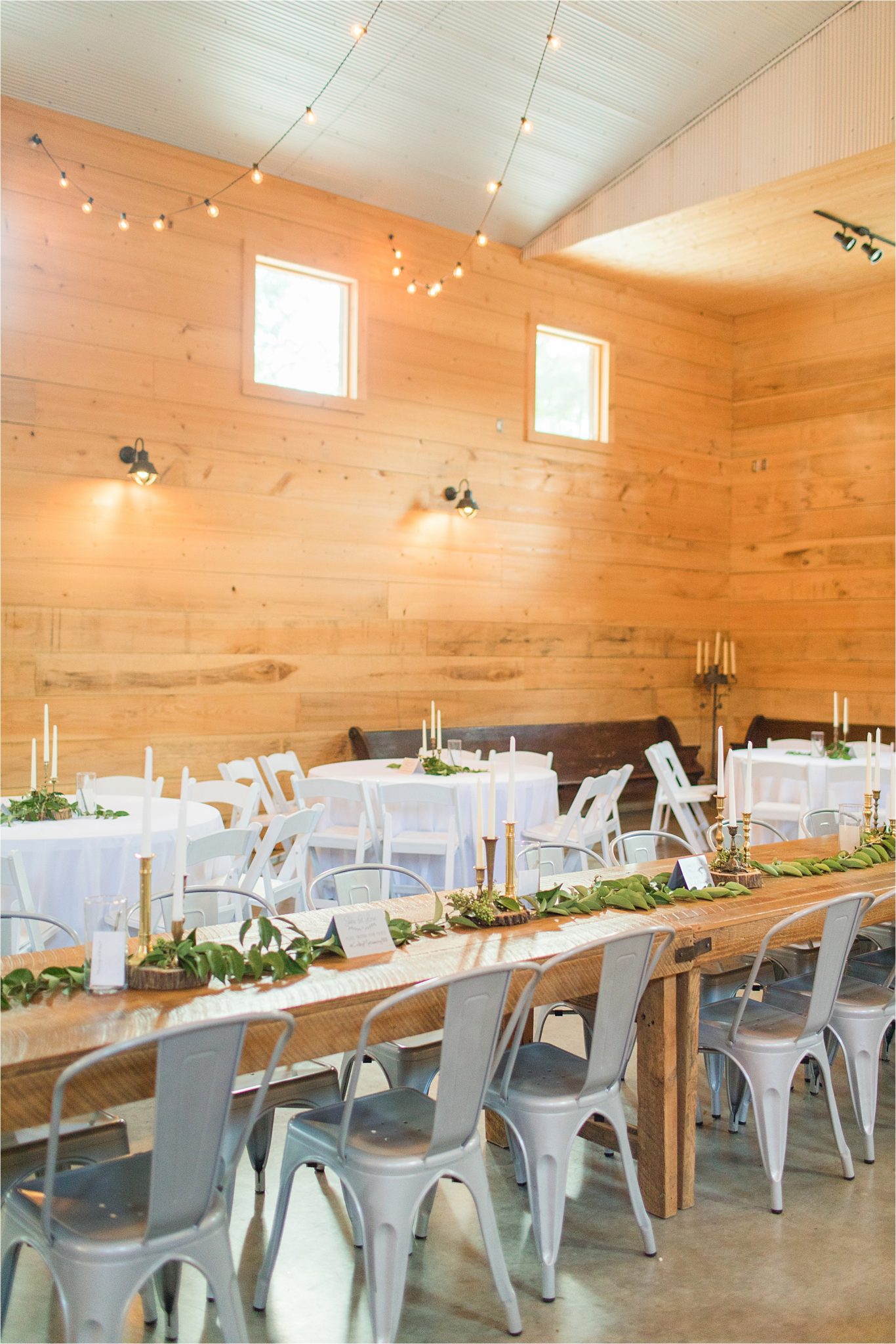 wedding-reception-alabama-venue-barn-farm-tables-metal-chairs-candle-centerpieces